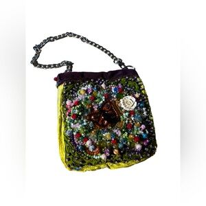Hand-crafted bead embroidered shoulder bag.